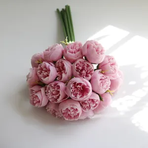 Detail of a 27-head pink artificial tea rose bouquet for home and wedding decor.