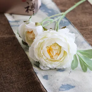 Exquisite macro detail of ivory white silk peony petals with realistic yellow stamens