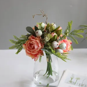 Close-up of artificial Penglai peony bouquet in a minimalist Nordic glass vase