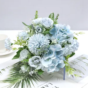 Detailed view of Nordic style light blue artificial rose and hydrangea bouquet for decor.