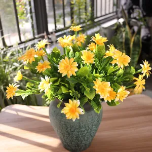 Close-up of vibrant yellow artificial chamomile flowers for balcony decoration