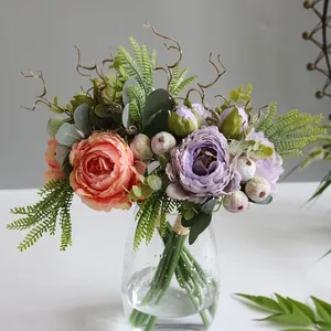 Close-up of Nordic style artificial peony bouquet in a clear glass vase