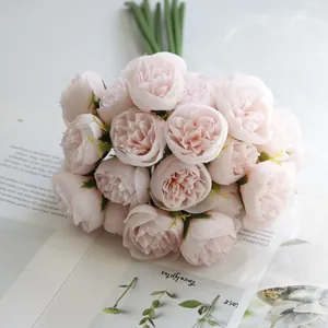 Macro detail of a 27-head artificial pink tea rose bouquet for wedding decor