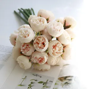 Macro view of 27-head cream peach artificial tea rose bouquet for home decoration