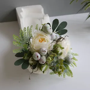 Detailed texture of artificial white peony petals and green foliage in Nordic style