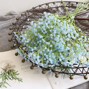 Detail view of light blue artificial baby's breath flower bouquet for home decoration.