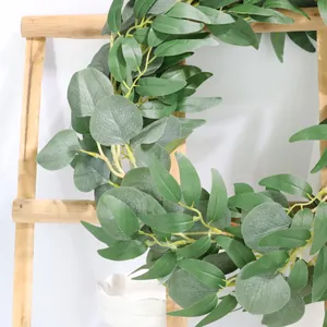 Detailed macro view of artificial eucalyptus and willow leaf garland for home decor