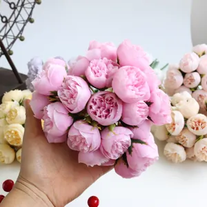 Detailed view of hand-held 27-head pink artificial silk tea rose bouquet for wedding decor