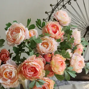 Detailed close-up of elegant peach silk peony flowers for home and wedding decor