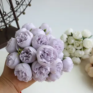 Detailed close-up view of a 27-head purple artificial tea rose bouquet for home decor