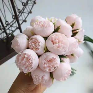 Detailed macro shot of a 27-head soft pink artificial tea rose bouquet for home decor