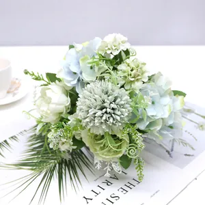 Close-up of pastel blue hydrangeas and white roses in a Nordic style bouquet
