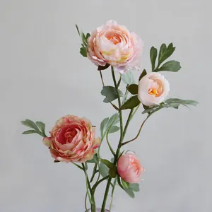Detailed macro view of delicate pink artificial peony silk flowers for decoration