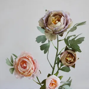 Detailed macro view of realistic silk peonies in vintage pink and mauve for home decor