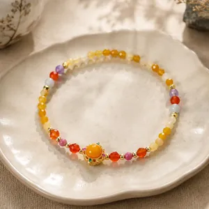 Bracelet en pierres naturelles de style chinois avec pièce centrale en filigrane doré