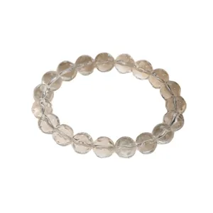Bracelet en cristal blanc naturel doté de perles texturées uniques en forme de météorite.