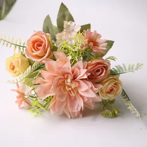 Detailed macro shot of silk dahlia and rose wedding bouquet in soft peach and cream