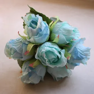 Detailed view of artificial blue rose bouquet with realistic gradient petals