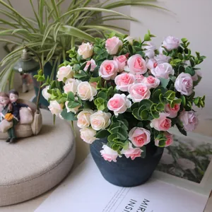 Detailed view of artificial pink and white rose bouquet with eucalyptus leaves in pot