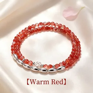 Élégant bracelet double rang en perles de cristal rouge avec breloques argentées en forme de riz