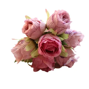 Bouquet of 7 artificial pink roses for wedding and home decoration on white background