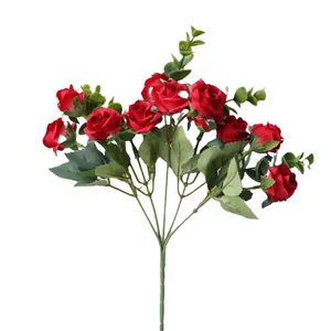 Vibrant artificial red rose bouquet with green eucalyptus leaves for wedding decor