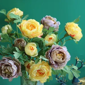 Elegant yellow and purple silk artificial Ranunculus flowers for home and wedding decor
