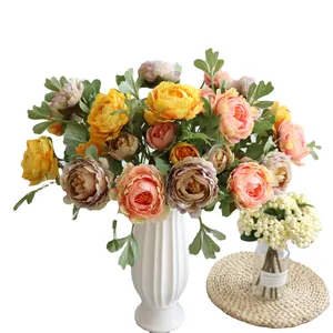 Artificial ranunculus flower bouquet in ceramic vase for home wedding decoration
