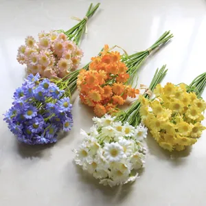 Collection of vibrant artificial daisy bouquets in various colors for home decor