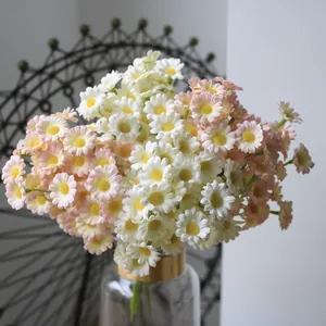Close-up detail of realistic white and pink artificial daisy flowers for home decoration
