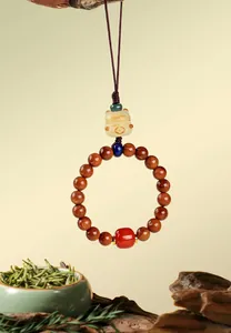 Close-up of Lucky Cat charm with Bodhi seeds and Southern Red Agate bead