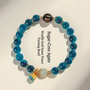 Bracciale vintage in agata verde petrolio con ciondolo a loto dorato e perla con scritte