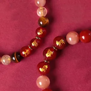 Bracelet en agate rouge et pierres multiples avec gravures du zodiaque
