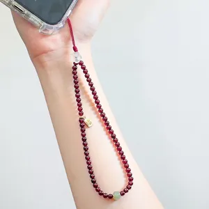 Elegant New Chinese style garnet beaded phone strap featuring a lucky blessing gold tag