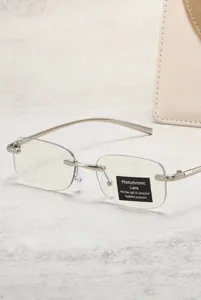 Detailed view of photochromic rimless reading glasses with protective film on lens