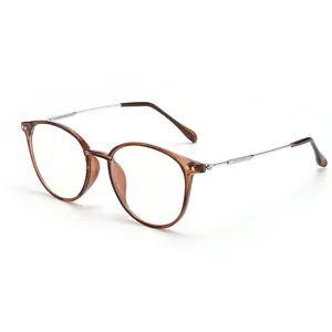 Stylish small oval eyeglass frame in tea brown finish with slim silver metal temples