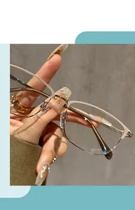 Detailed close-up of vintage semi-rimless anti-blue light reading glasses for women in gold
