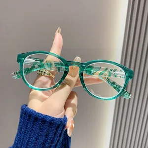 Detail shot of stylish green transparent anti-blue light reading glasses with spring hinges