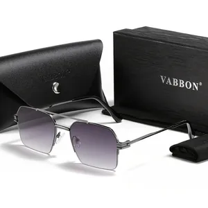 Close-up of metal square frame sunglasses with gradient lenses and branded gift box