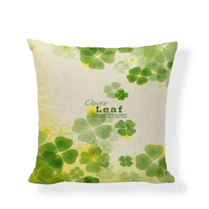 Detailed texture view of linen cushion cover with green clover leaf print design