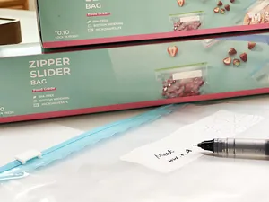 Close-up of food storage slider bag with a writable label for organization
