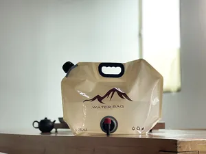 Close-up detail of an 8L collapsible outdoor camping water bag with faucet on a table