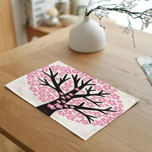Close-up of pink cherry blossom tree pattern on linen placemat texture