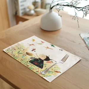 Detail of linen placemat featuring hand-drawn girl and nature illustration on table