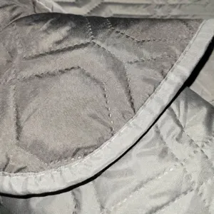 Waterproof grey quilted pet mat for bed and car seat protection with durable stitching