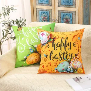 Decorative Happy Easter throw pillow covers with bunny and egg prints on a white sofa