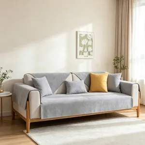 Detail van grijze waterdichte bankovertrek met stoftextuur en minimalistische woonstijl