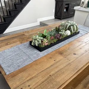 Modern gray thick linen table runner detail on a rustic wooden dining table set