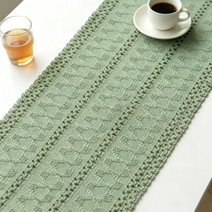 Detailed close-up view showing the intricate texture of green crochet table runner