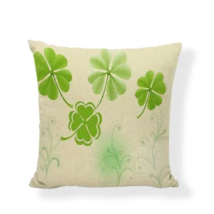 Detailed view of a square cotton-linen cushion cover featuring a vibrant green clover pattern